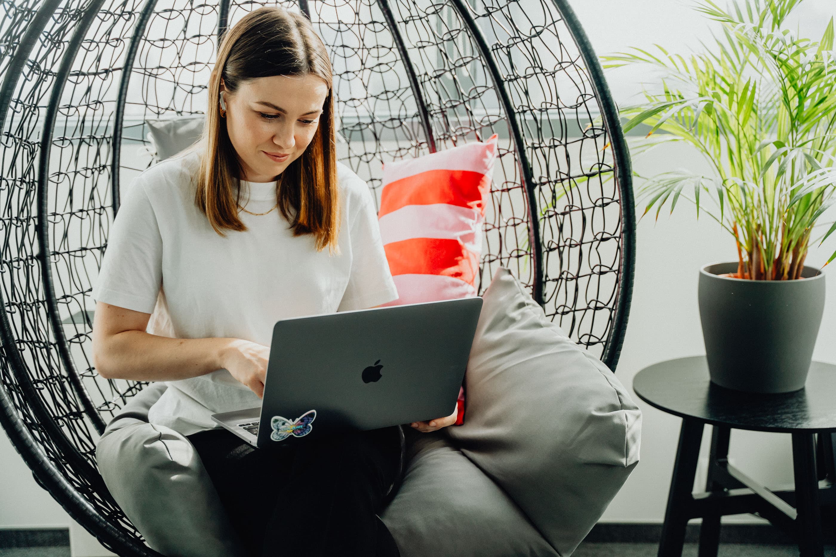 Healthcare professionals using project management software on laptops and tablets.