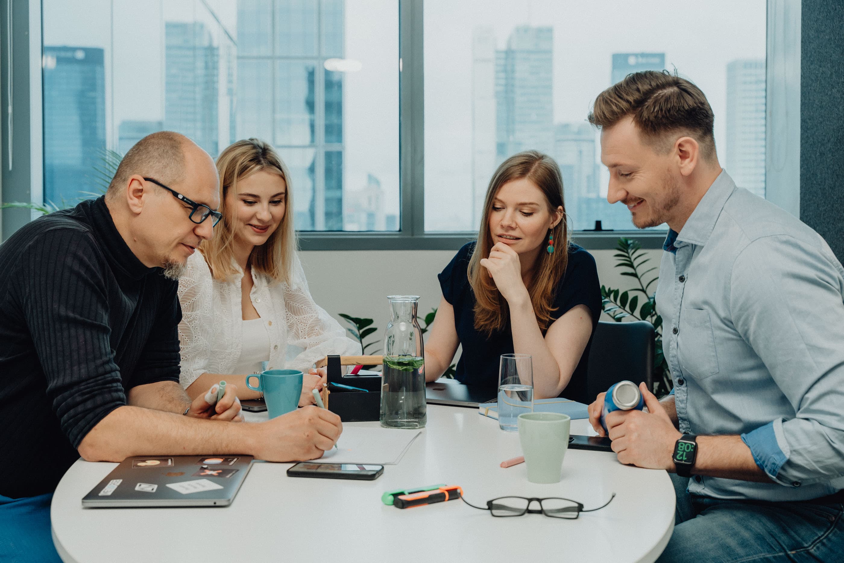 Developers at Startup House in Poland working on OpenAI API integration.