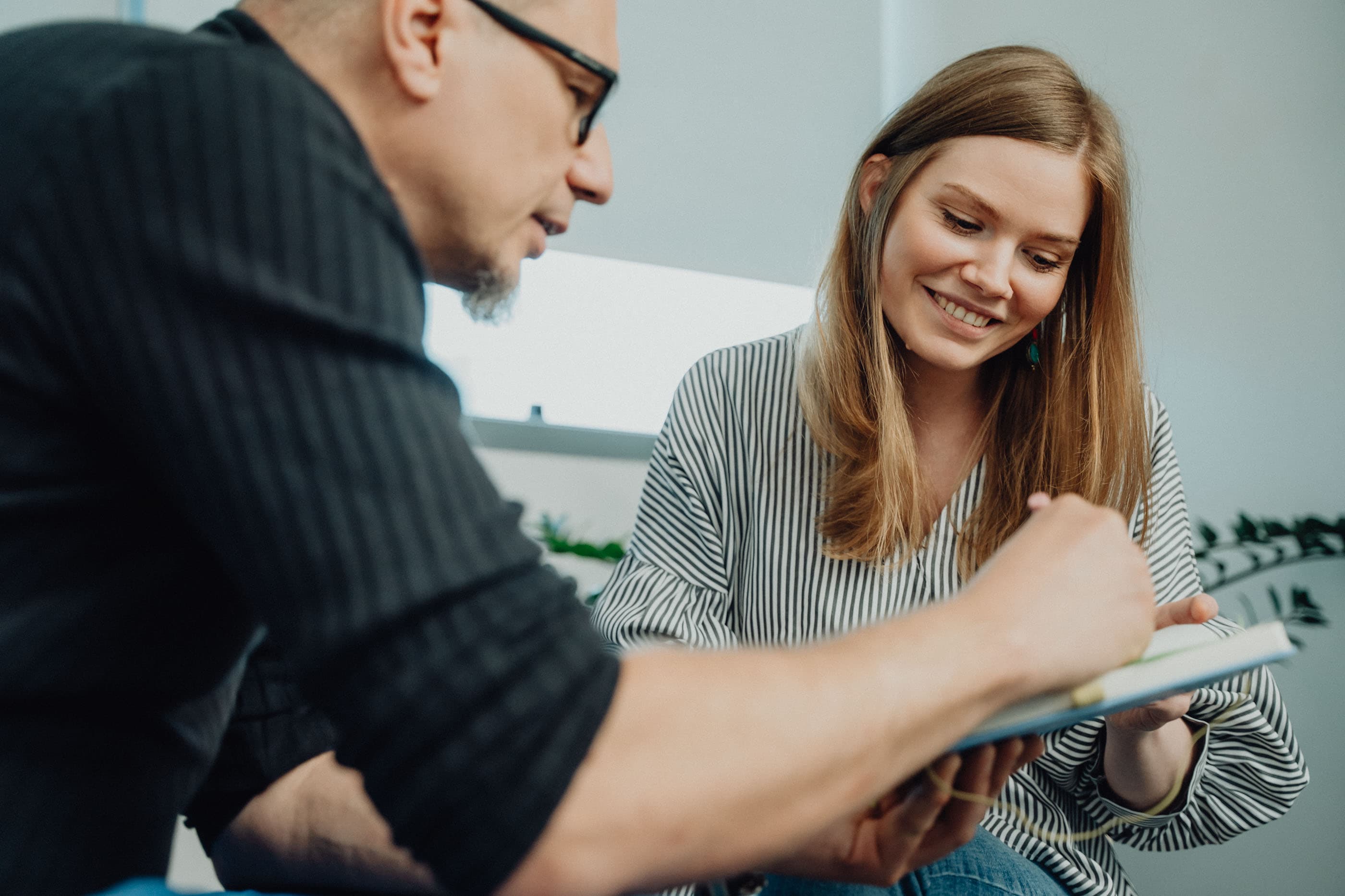 Financial adviser using AI-driven tools to analyse investment data and market trends in a modern wealth management office.
